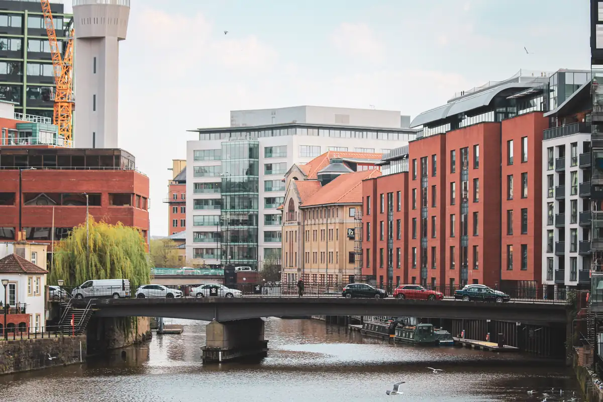0117 Bristol Phone Numbers Modern offices and brick buildings beside the water in Bristol