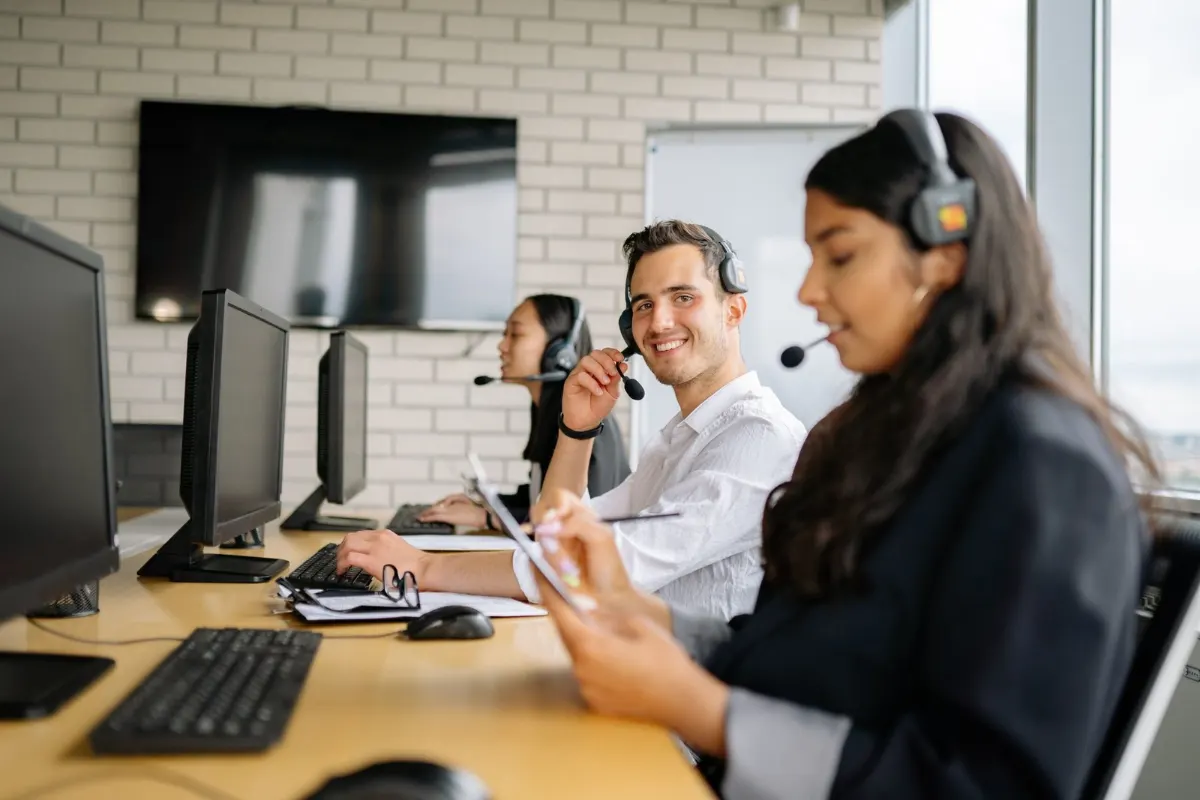 CCaaS agent on a headset handling a customer call in a bright contact centre